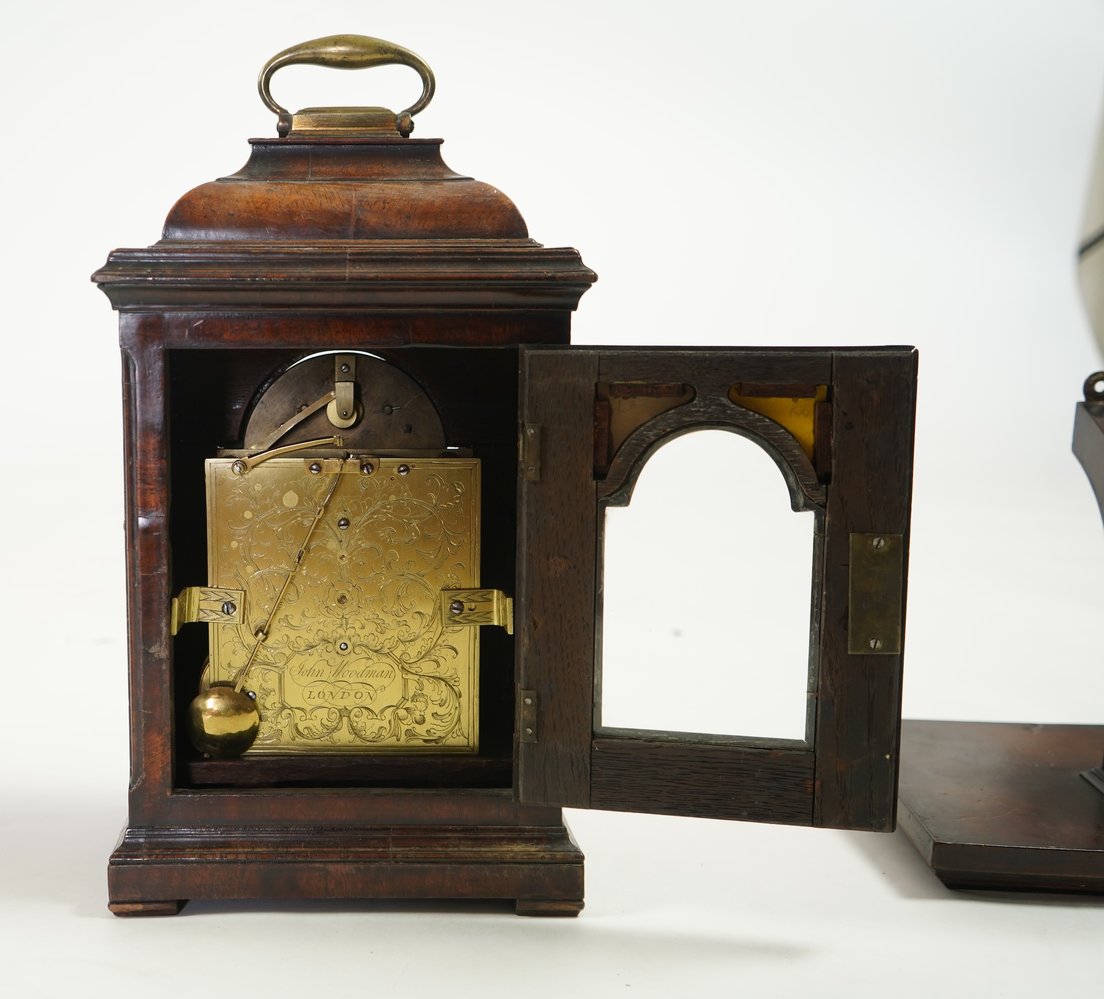 A George II walnut and brass mounted bracket clock, signed John Woodman